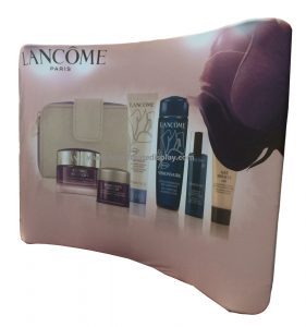 Curved exhibition backwall with a cosmetics graphic, shown in a catalog illustration