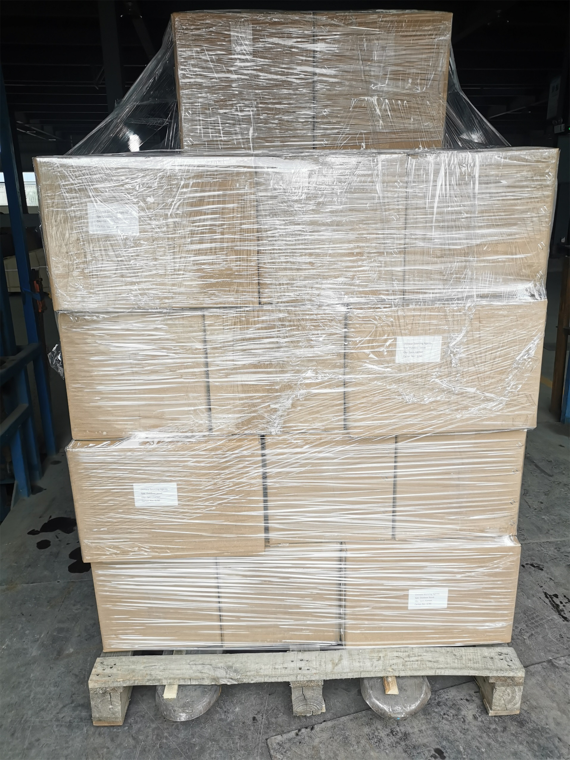 Wrapped carton stacks on a timber shipping pallet