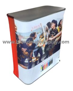 Portable exhibition counter with a printed front graphic and dark tabletop