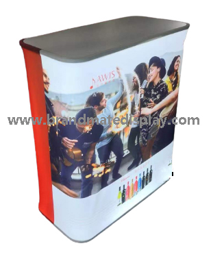 Portable exhibition counter with a printed front graphic and dark tabletop